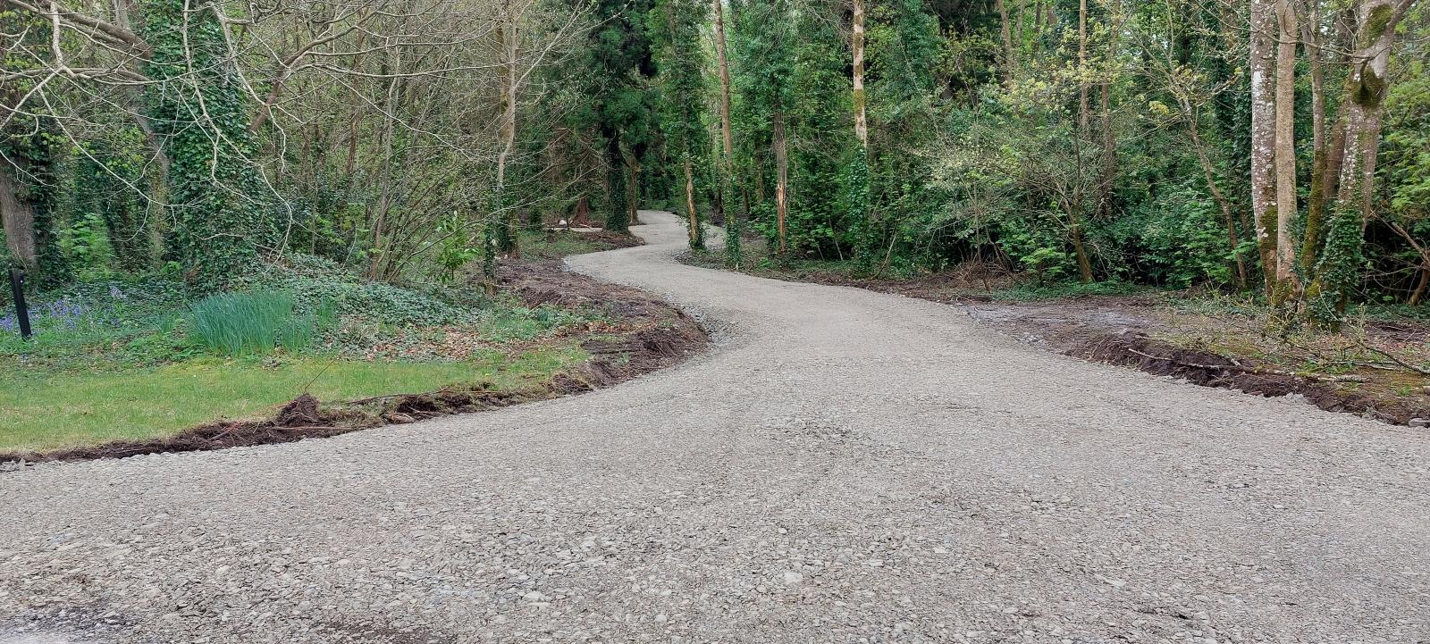 Home 22 Newly constructed forest road winding through woodland in Ireland